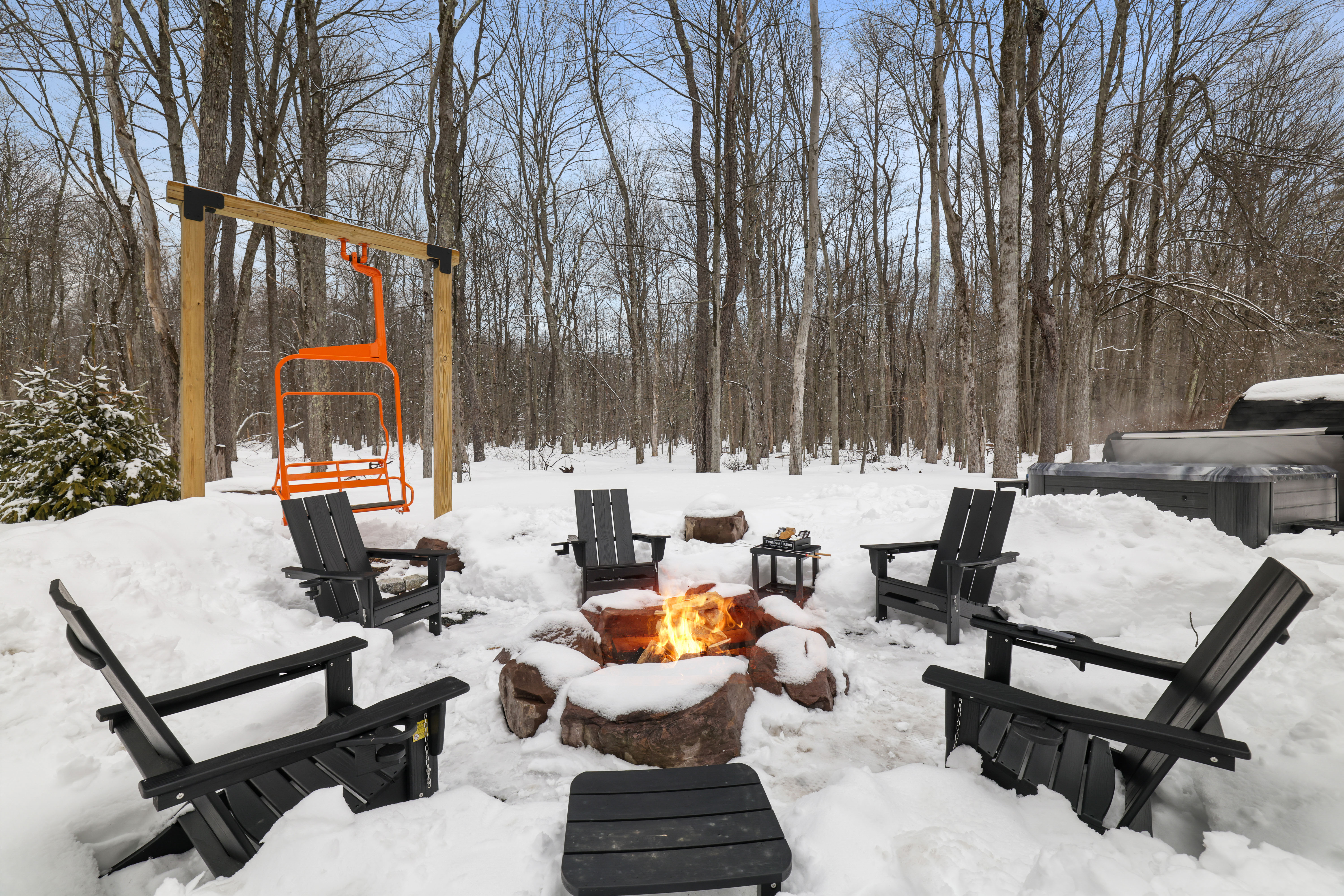 Firepit area with ski lift chair swing